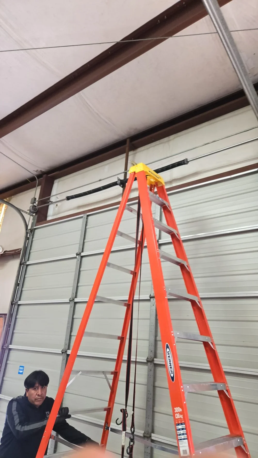Royalty technician working on a residential garage door